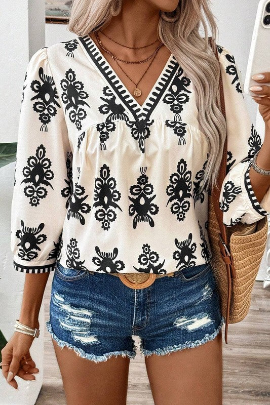 Joy - Blouse élégante à imprimé géométrique, manches mi-longues et col en V