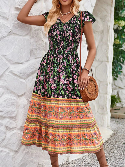 Cassandra - Robe fleurie élégante à manches courtes