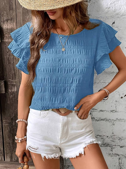 Catty - Élégante blouse à manches courtes avec volants superposés et bords texturés