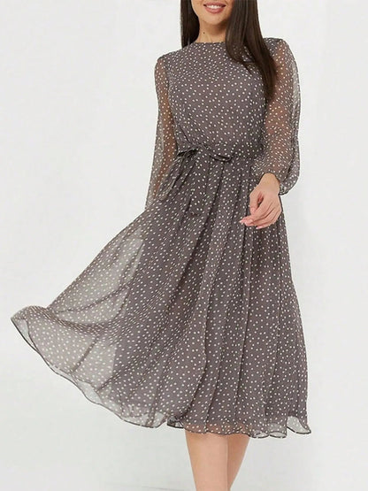 Zahra - Élégante robe midi à manches longues, col rond et pois