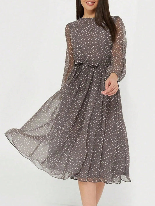 Zahra - Élégante robe midi à manches longues, col rond et pois
